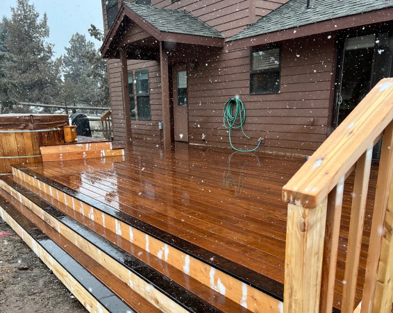 deck with a staircase and a rainy day redmond or